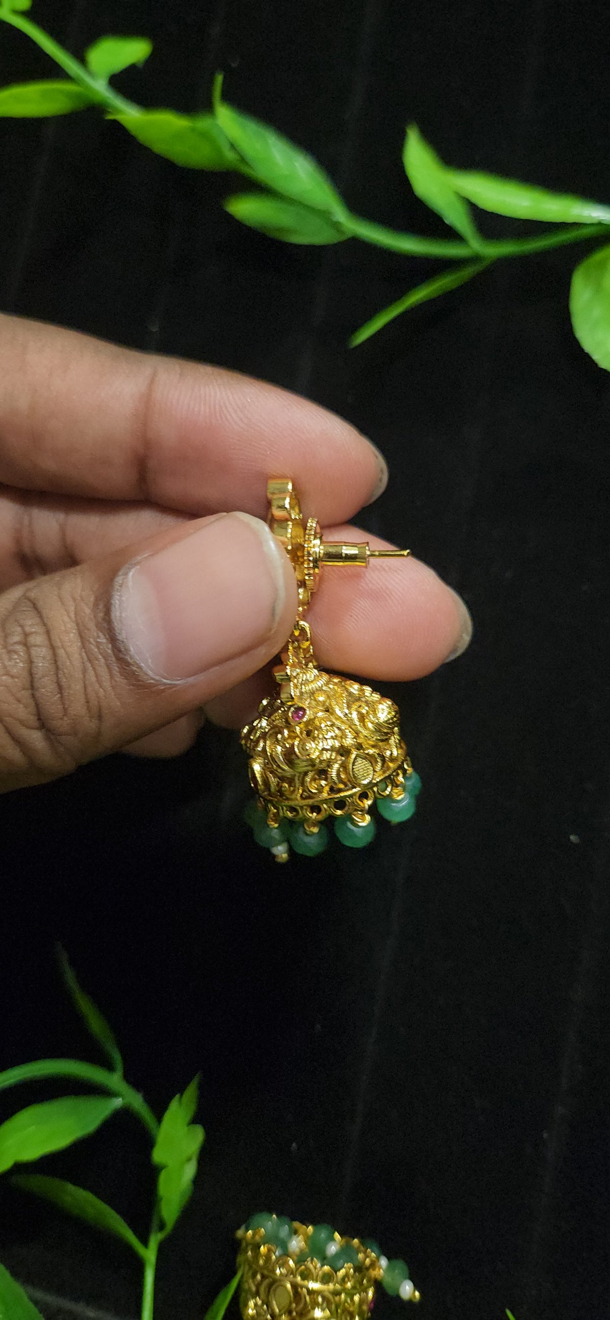 Antique Finish Peacock Design Jhumka with Ruby Accents & Green Bead Drops