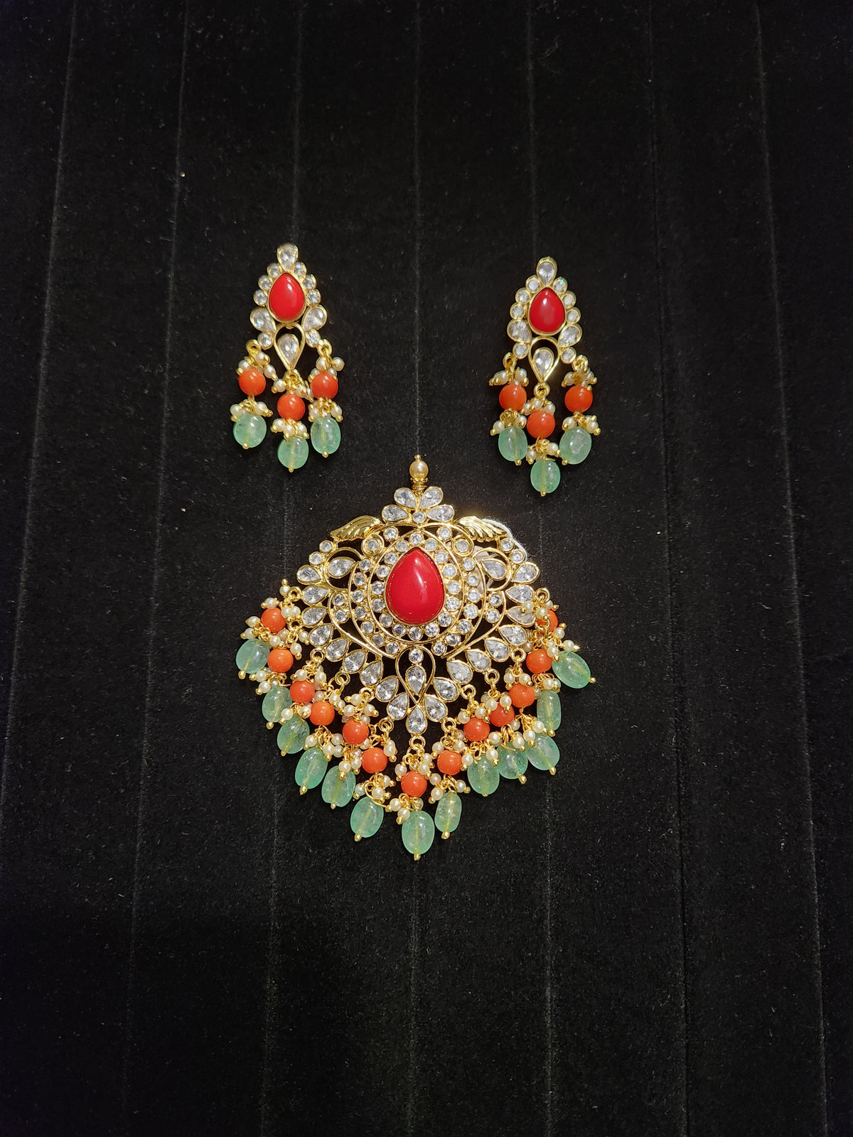 Gold Finish Polki Pendant Set with Coral & Ruby Drops