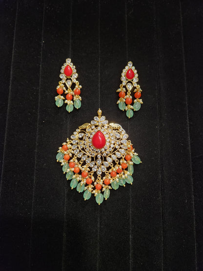 Gold Finish Polki Pendant Set with Coral & Ruby Drops