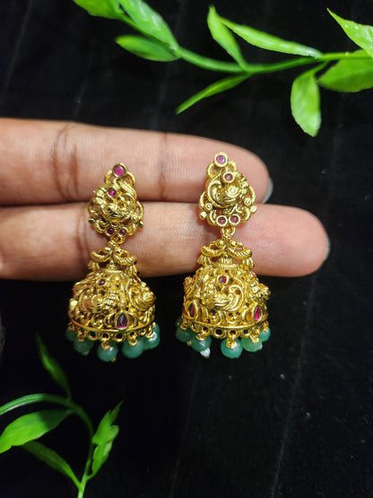 Antique Finish Peacock Design Jhumka with Ruby Accents & Green Bead Drops