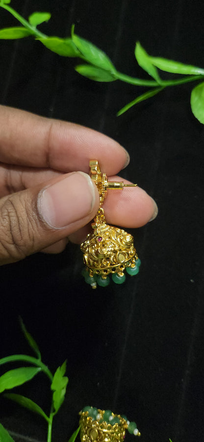 Antique Finish Peacock Design Jhumka with Ruby Accents & Green Bead Drops