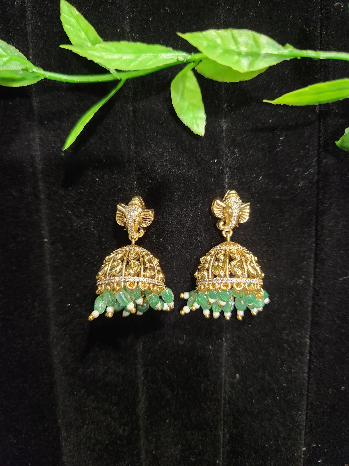 Antique Finish Ganesh Jhumka Earrings with Green Bead Drops