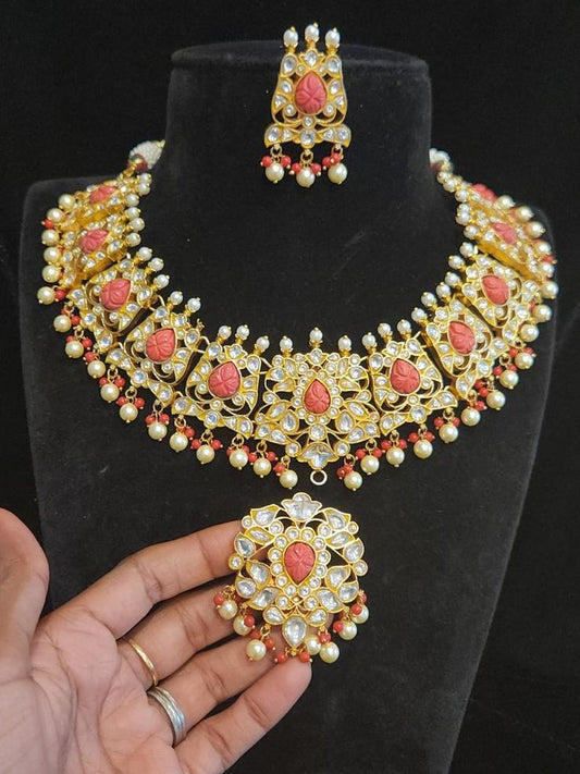 Gold finish kundan heavy neckset with corals and detachable pendant