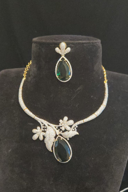 Jewelry set with necklace and earrings on a black mannequin bust